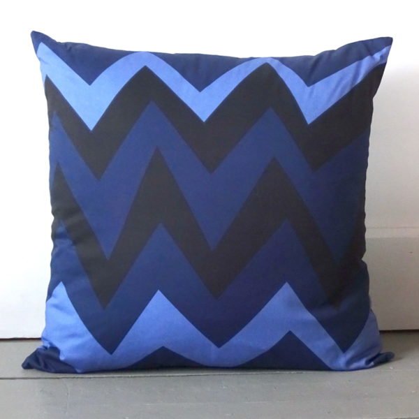 Madam X back of cushion with zigzag pattern in blues. 100% cotton light twill. wicked imp designs
