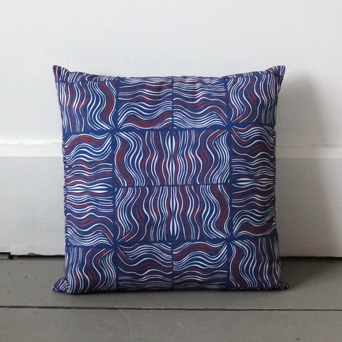 small cushion wavy lines in blue red and white called making waves wicked imp degsigns
